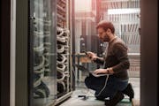 Man on phone in working Data Center